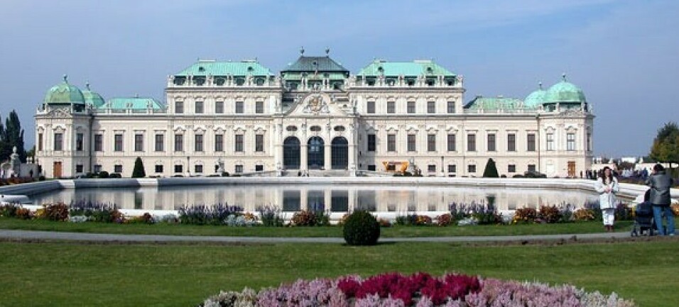 Belvedere Palace with pink flowers blooming in the front