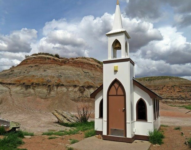 Little church in Drumheller, with badlands in the background