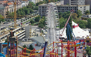 Prater with Farris wheel and  the rollercoaster in front during the day